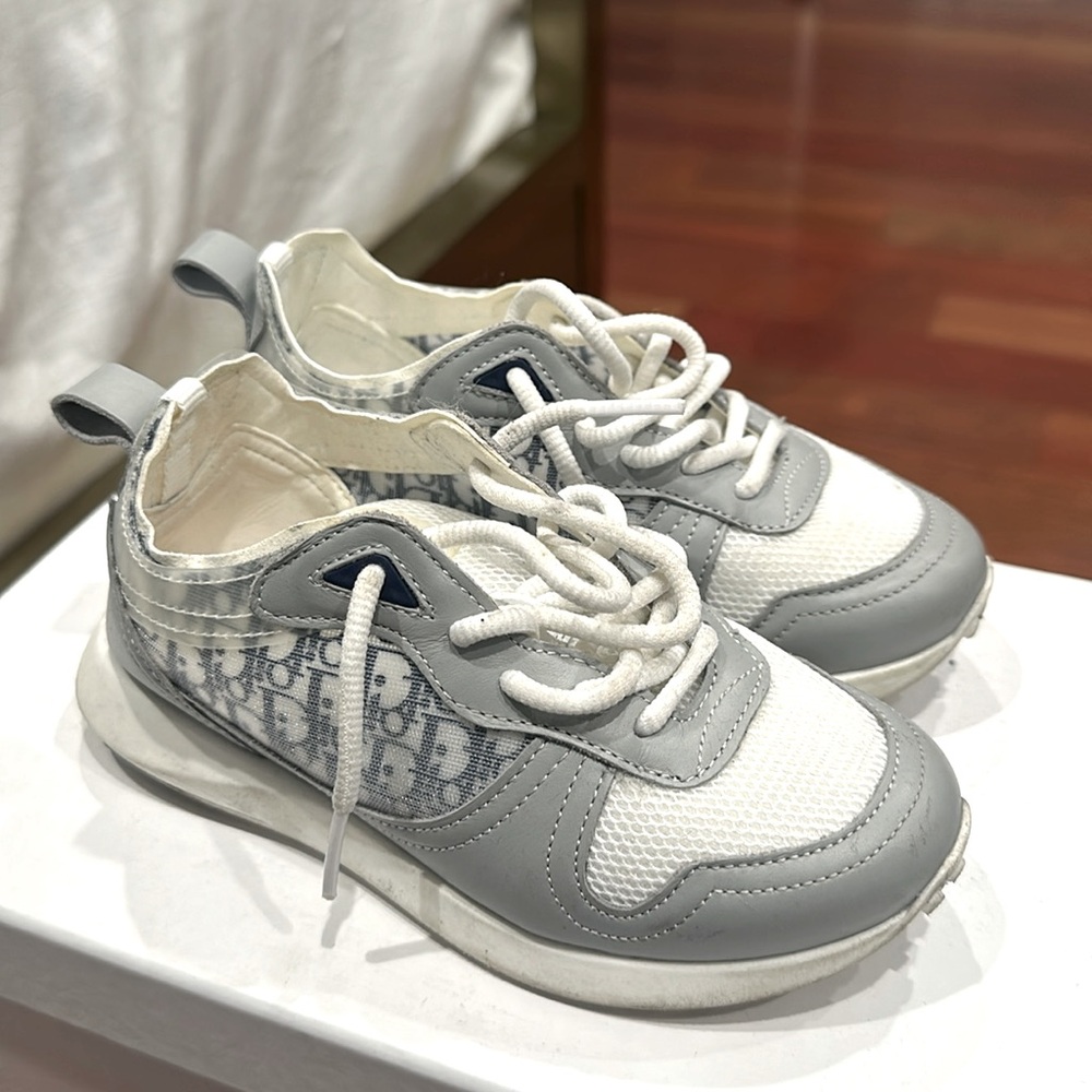 Authentic Dior kids  sneakers run exact would size up. Originally $710.